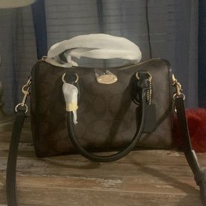 Coach Brand new crossbody purse. Never been used and in mint conditions.